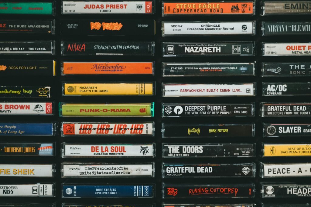 A nostalgic display of vintage cassette tapes featuring iconic bands and albums from the past.